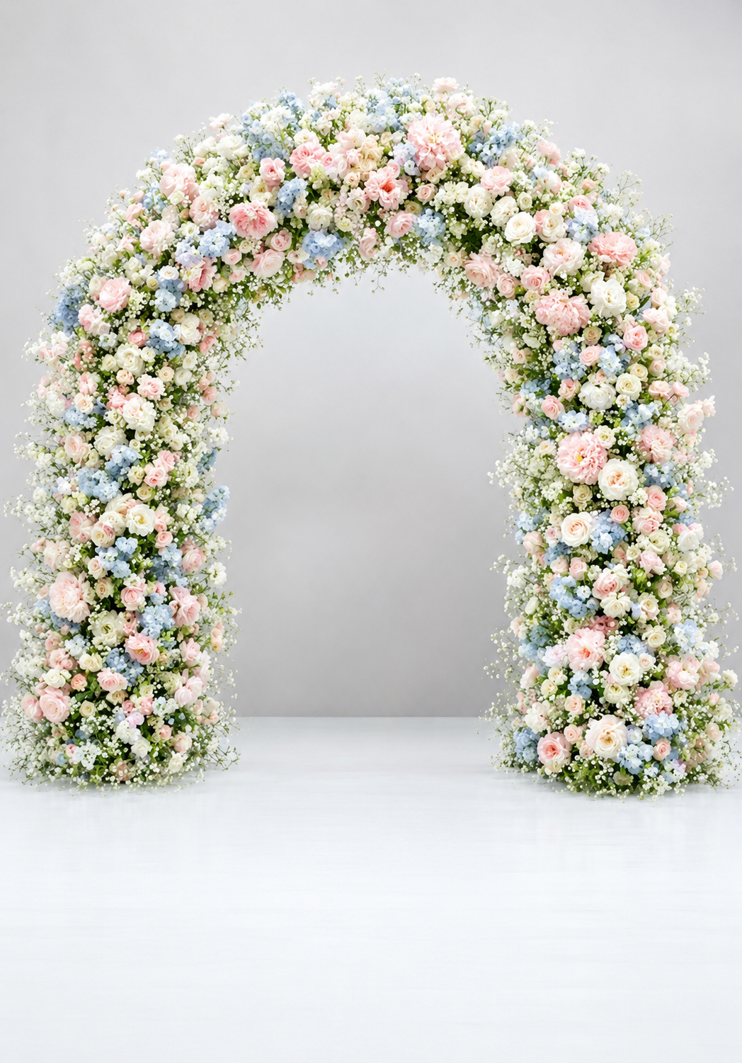 LUXURY FULL FLOWER AND FOLIAGE ARCH IN GYPSOPHILIA, BLUE HYDRANGEAS & ROSE PINKS