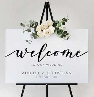 Black Welcome to Our Wedding Sign & White & Foliage Arrangment