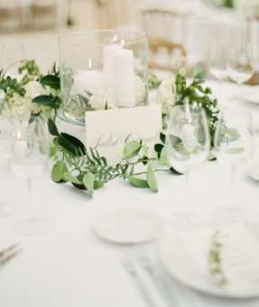 Wide Glass Vase & Artificial Candles Complimented with a Single String of Artificial Foliage / Eucalyptus