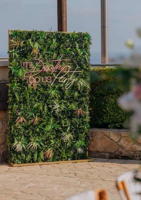 Til Death Do Us Party Neon Sign With Modern Foliage Wall