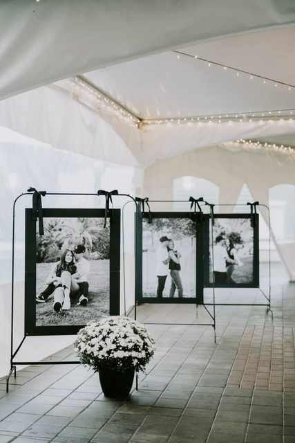 Set Of 3 Black Stands With Ribbon Ties With Flower Arrangements & A1 Prints